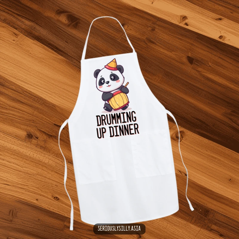Funny apron featuring a cute cartoon panda in a conical hat, energetically playing a drum while cooking.