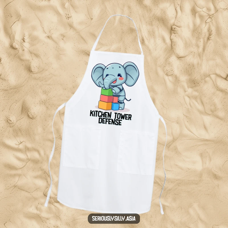 Funny Apron depicting a giggling elephant bot balancing a tower of small, colorful blocks, perfect for kitchen amusement.