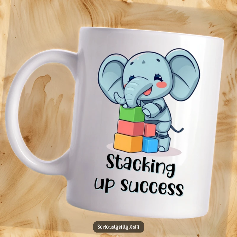 Funny Elephant Bot Mug showing a giggling bot elephant precariously balancing a tall tower of colorful blocks, delightful.
