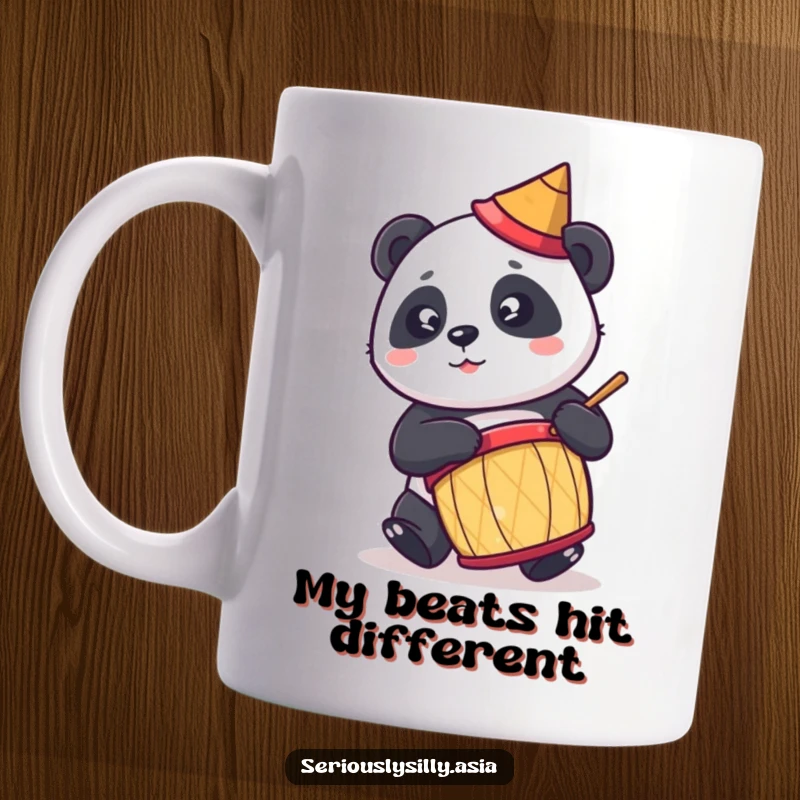 Funny mug featuring a cute cartoon panda in a tiny conical hat, joyfully playing a drum with energetic enthusiasm.