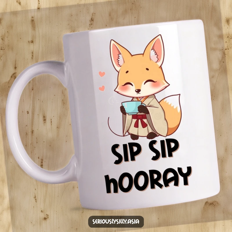 Funny mug featuring a smiling cartoon fox in an elegant patterned kimono, gracefully sipping tea with a serene expression.