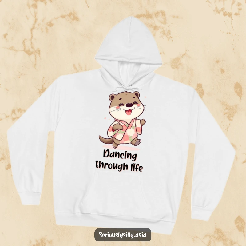 Funny hoodie with a playful cartoon otter wearing a floral kimono, joyfully doing a little shuffle with infectious enthusiasm.