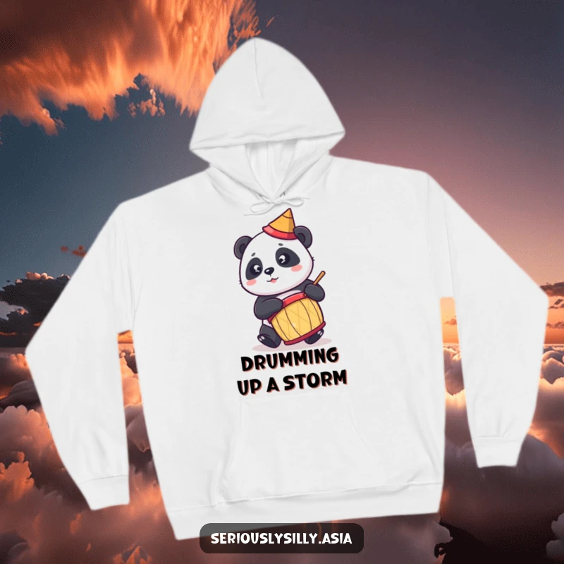 Funny hoodie showcasing a cute cartoon panda wearing a conical hat, enthusiastically playing a drum with infectious energy.