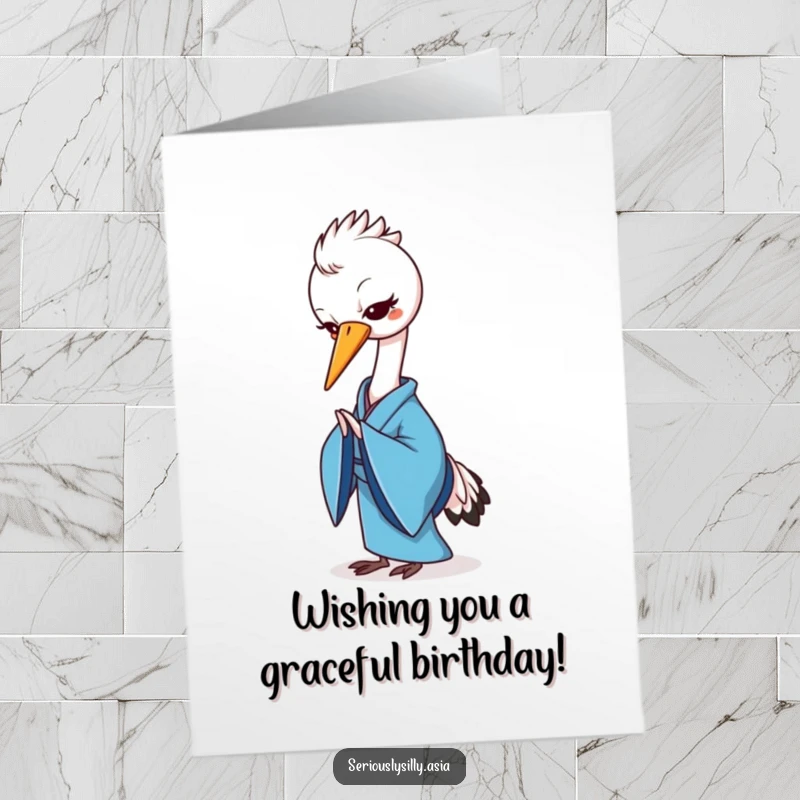 Funny Free Printable birthday card featuring a cheerful cartoon crane in a blue kimono gracefully bowing.