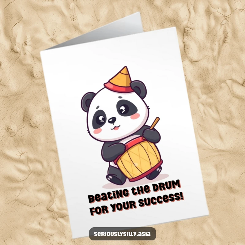 Funny Free Printable congratulations card showing a joyful cartoon panda pounding a drum with excitement.