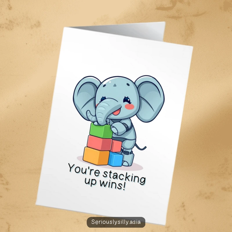 Funny Free Printable Congrats Card: Giggling elephant bot beams while balancing a tower of colorful blocks.