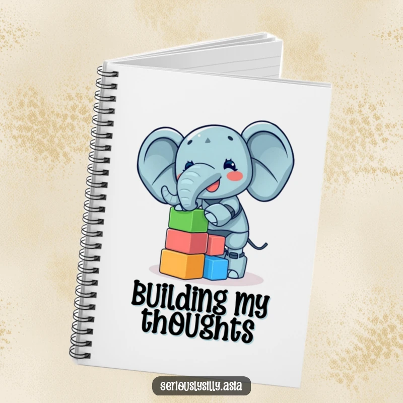 Funny Notebook with a giggling elephant bot balancing a tower of colorful blocks, perfect for writing down fun ideas.