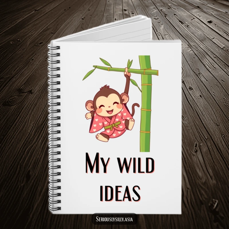 Funny notebook featuring a happy cartoon monkey in a bright kimono, swinging from a bamboo stalk, ready for notes.