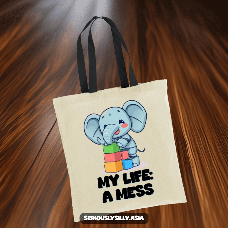 Funny Tote Bag showcasing a giggling elephant bot precariously balancing a tower of small, colorful blocks, a delightful accessory.