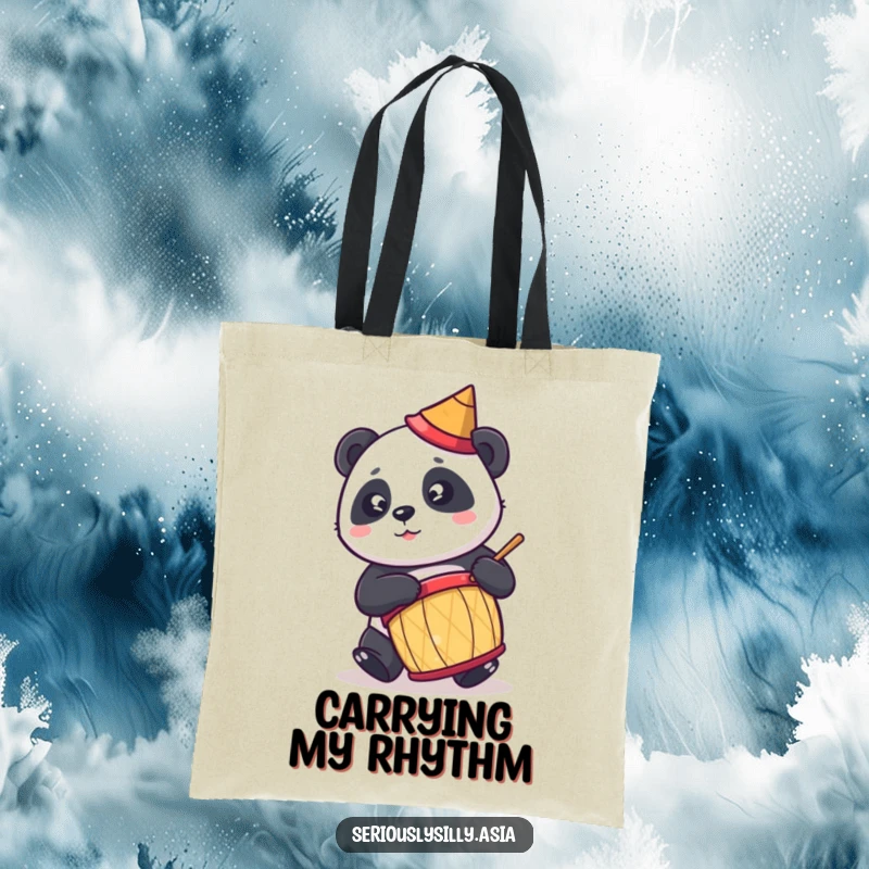 Funny tote bag featuring a cute cartoon panda in a tiny conical hat, enthusiastically playing a drum.